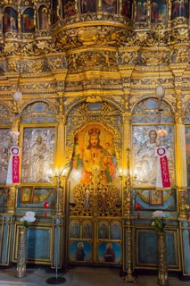 Interior of an Orthodox church with gold-decorated icons and religious artworks, Panaghia Church,