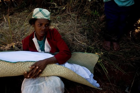 Young woman participating in a famadihana. This funerary tradition is also known as the turning of