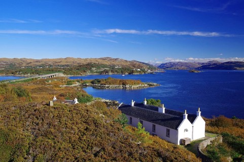 White house on a tranquil inlet surrounded by colourful hills and mountains, October, Kyle of