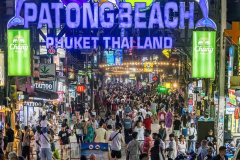 Crowds of people on Bangla Street in the evening. Nightlife on Bangla Walking Street with go-go