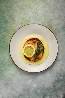 Salmon steak, fried, mashed potatoes, top view, rosemary, lemon and lime, homemade, one serving, no