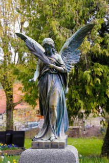 Historic cemetery Gönningen, angel figure, sculpture of a woman with wings, statue, stone figure,