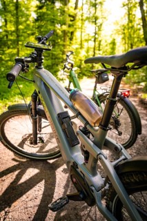Two e-bikes on a forest path, illuminated by sunbeams in the background, e-bike, forest bike, Calw,
