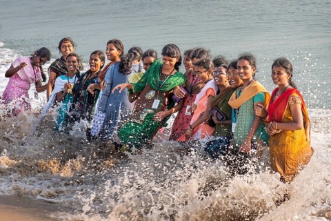 Group of laughing young woman standing in the surf, Adam's Bridge, Rameswaram Island, near