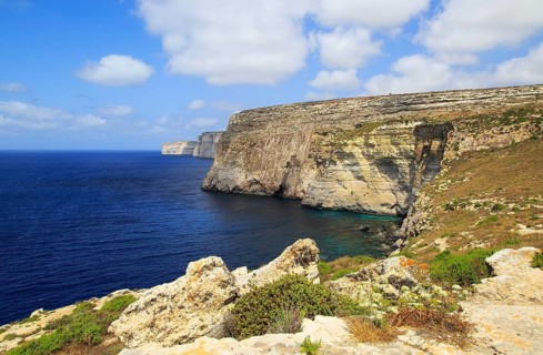 Coastal clifftop landscape view westwards at Ta' Cenc cliffs, island of Gozo, Malta, Europe