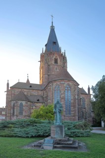 Benedictine monument in front of the Romanesque church of St Peter and Paul, Benedictine monument,