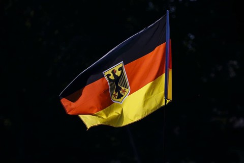 Symbolic photo. The national flag of the Federal Republic of Germany with a federal eagle