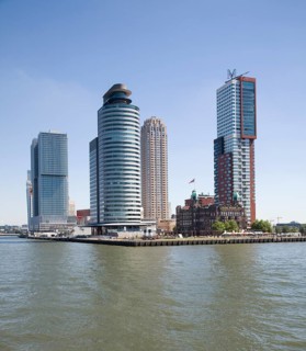 Historic Hotel New York building dwarfed by modern skyscrapers, Rotterdam, Netherlands