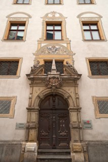 Entrance portal with the alegories of Faith and Peace from the Baroque town hall from 1661,