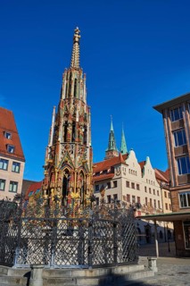 Deserted view of the beautiful fountain (Schöner Brunnen) in times of Corona (COVID-19),