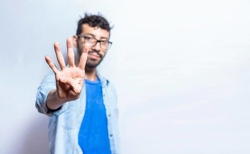 Portrait of people counting number four on isolated background. Person hand counting number four.