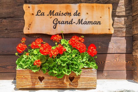 Information board for the local history museum La Maison de Grand-Maman, historic village centre,