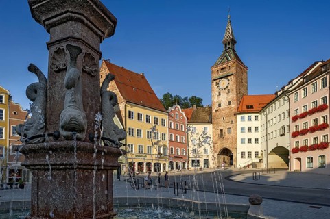 Medieval gate tower, Schmalzturm town gate or beautiful tower, baroque sculptures as gargoyles,