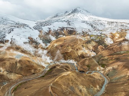 Steaming hot springs and colourful rhyolite mountains, aerial view, Hveradalir geothermal area,