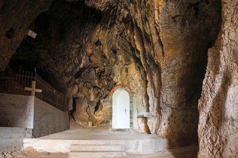 Entrance to cave with play of light, striking rock formation and steps, Church of Mary the Fountain