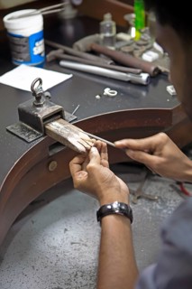 Sri Lankan man cutting a ring, gemstone cutting workshop in Kandy, Central Province, Sri Lanka,
