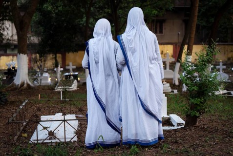 Nuns offer prayers on the grave during the All souls day observation, in Guwahati, India on 2