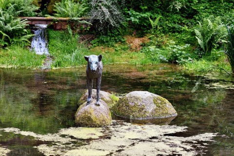 Heidelberg, Germany, June 8th 2024: Wolf sculpture at historic well called 'Wolfsbrunnen' in