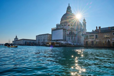 View from a gondola on 'Basilica the Santa Maria della Salute' next to Canal Grande' in Venice on a