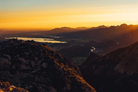 View from the Aggenstein to the Forggensee and the Ammergebirge at sunrise, Bavaria, Germany,