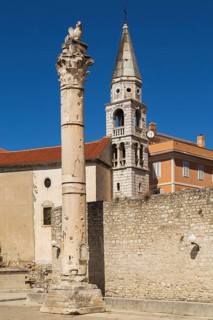 Pillar of Shame and Saint Elias Church bell tower in the old Croatian public square, Old Town of