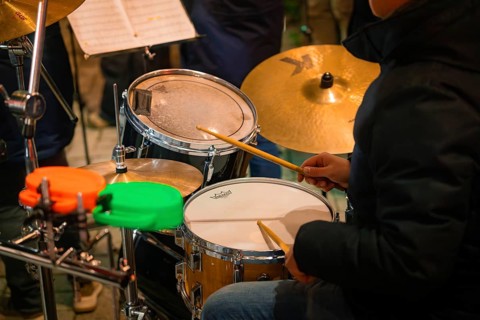 A musician plays drums, focus on the drums, Lichternacht Fest, Nagold, Black Forest, Germany,