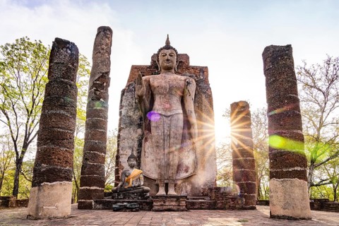 The giant standing Buddha in the temple Wat Saphan Hin, UNESCO World Heritage Sukhothai Historical