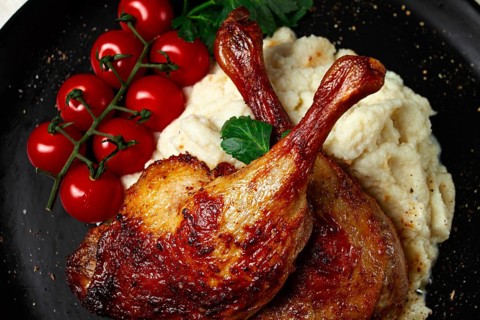 Fried duck shank, cauliflower puree, cherry tomatoes, homemade, no people