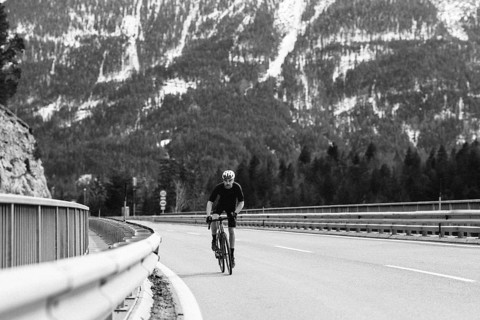 Road bike rider in spring between Lechtal and Tannheimer Tal in front of picturesque scenery of the