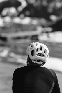 Road bike rider in spring in the Allgäu against the picturesque backdrop of the Alps, Bavaria,