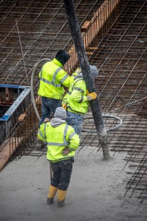 Construction site, concreting, the foundation of a building is concreted, the concrete is pumped