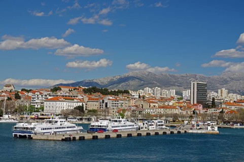 Passenger ferries and parts of the city centre, skyscrapers and mountains, Split, Dalmatia,