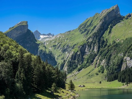 Lake Seealpsee, Alpstein mountain range near Wasserauen, peak of Mt. Säntis in the back, Appenzell,