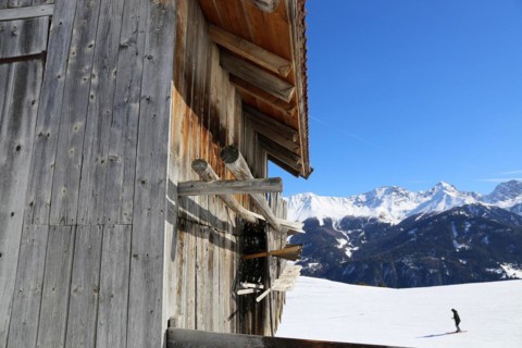 The Serfaus, Fiss, Ladis ski area in winter. In the foreground a wooden hut typical of the