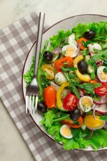 Vegetable salad, with quail eggs and olives, fresh, close-up, no people