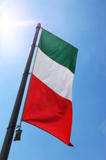 Italian national flag against a blue sky