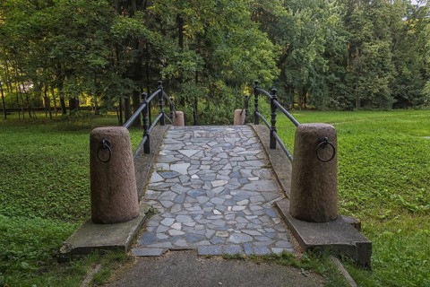 Old stone bridge in the park. Belarus