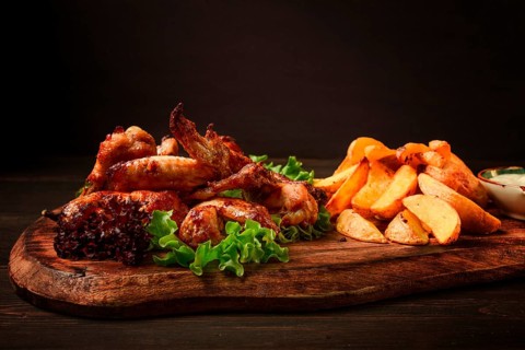 Fried chicken wings, with potatoes, and spices, homemade, fast food, no people