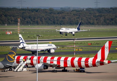 Düsseldorf Airport, Lufthansa Airbus on landing, Aegean Airlines Airbus A320-200 on the taxiway,