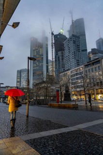 Rainy weather, freezing rain, Goetheplatz, high-rise skyline in clouds, passers-by hurrying through