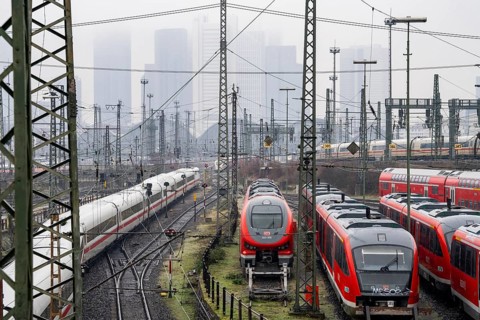 Railway tracks with regional and long-distance trains, ICE, after freezing rain, in front of
