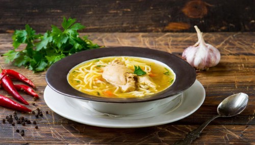 Food, a plate of chicken soup with noodles on a wooden table, AI generated, AI generated
