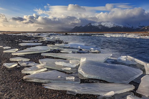 Ice floes on the beach, snowy, waves, sea, cloudy mood, winter, Lonsvik, Höfn, Iceland, Europe