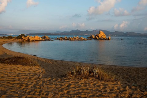 Lonely beach with granite rocks, sunrise, Spiaggia Poltu Manzu, Capo Ceraso, near Olbia, Sardinia,