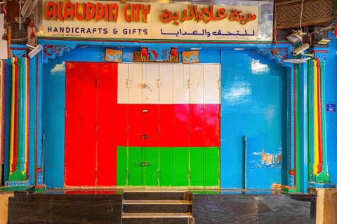 Closed shop in the souk of Mutrah, with the colours of the Omani national flag, Muscat, Arabian