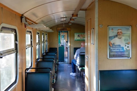 Nostalgic train interior with wooden panelling and retro atmosphere, Rügen, Rasender Roland