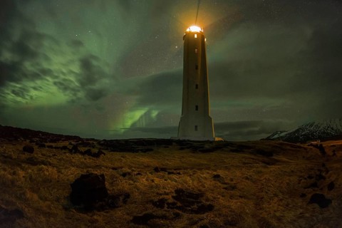 Northern lights or aurora borealis, lighthouse sends light signal, Malarríf, Snæfellsnes Peninsula,
