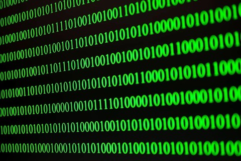 Parallel green binary code lines on a black background