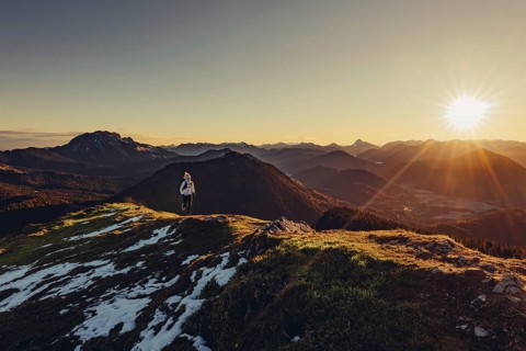Trail running in autumn on the Jochberg on Lake Walchensee against the wonderful backdrop of the