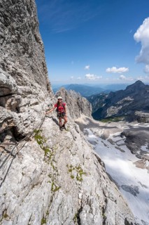 Mountaineer with helmet in a secured via ferrata, Zugspitz via ferrata, ascent to the Zugspitze,